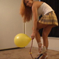 Sexy blonde pedal pumping air foot pump in pantyhose and high heels blowing up big party balloons on Adult XXX Video