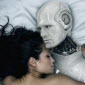 sexy naked woman with big breasts snuggling in bed and sleeping with robot lover sex machine