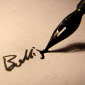 fountain pen writing nom de plume pen name in black ink